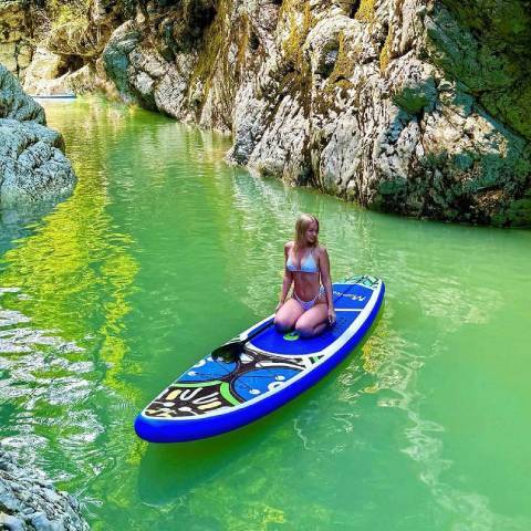 Girl paddling with Feath-R-Lite inflatable SUP board