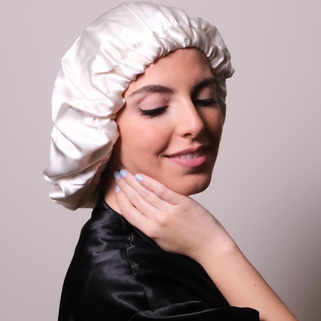 Woman wearing a white silk hair bonnet