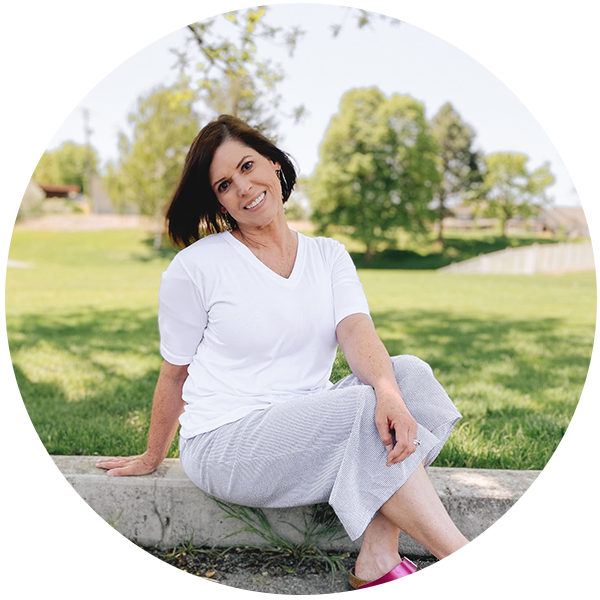 Close-up image of Shelley Weeks, a woman with a friendly smile and casual attire.