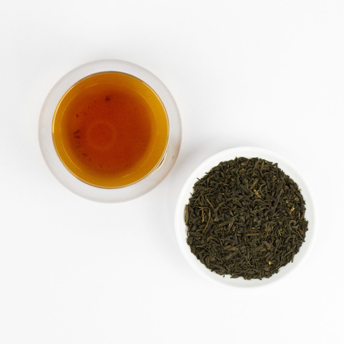 Yamabuki Nadeshiko loose leaf and steeped tea, dry leaf beside rose-coloured liquor
