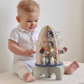 Little boy playing with the Montessori STEM Rocket toy.