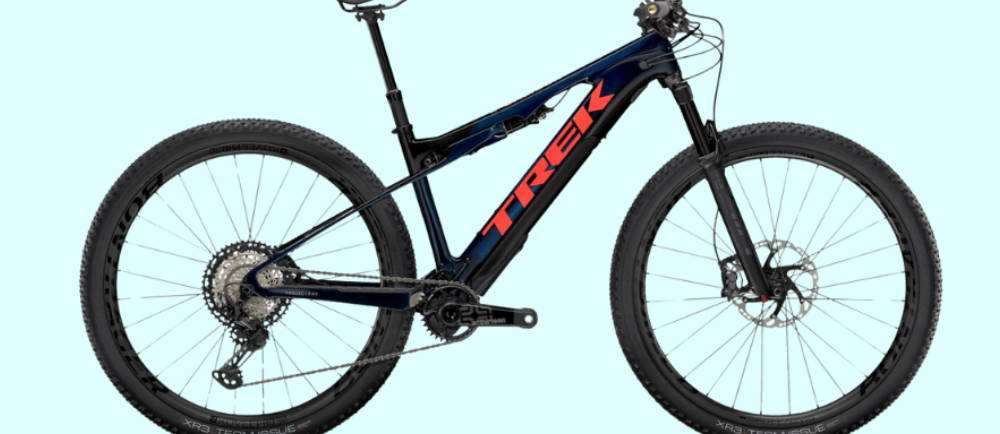 a black Trek E-Caliber 9.8 XT Gen 2 electric mountain bike