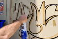 Spraying on World's Best Sensitive Surface Graffiti Remover