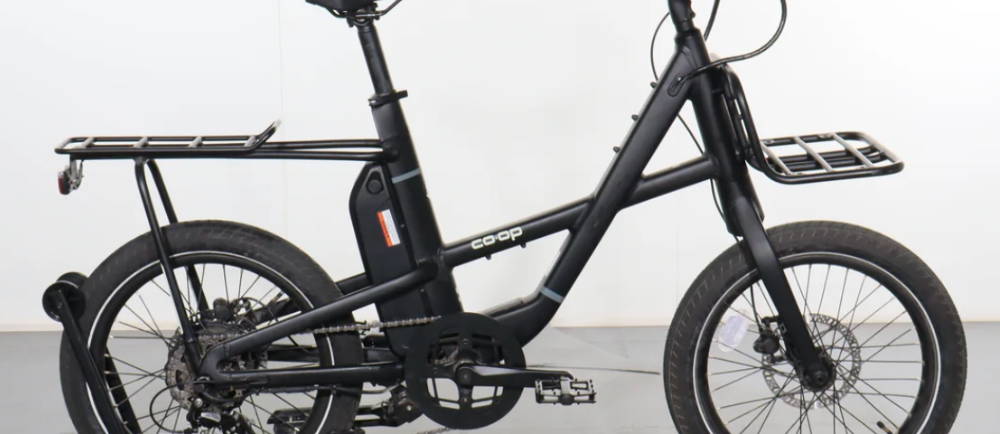 a black Co-Op Generation e1.2 electric cargo bike