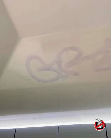 removing graffiti tags from bathroom partitions using safewipes