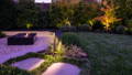 Garden spike lights illuminate feature trees and planting beds in this Scoresby VIC landscape by Havit.