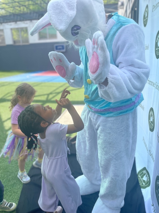 A child and a Easter Bunny in Costume