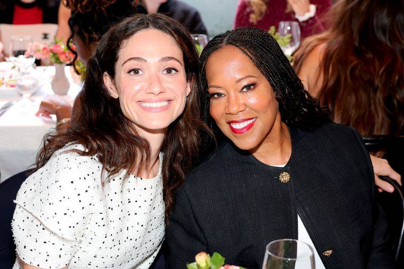 Image may contain: Emmy Rossum, Regina King, Face, Happy, Head, Person, Smile, Photobombing, Adult, and Wedding