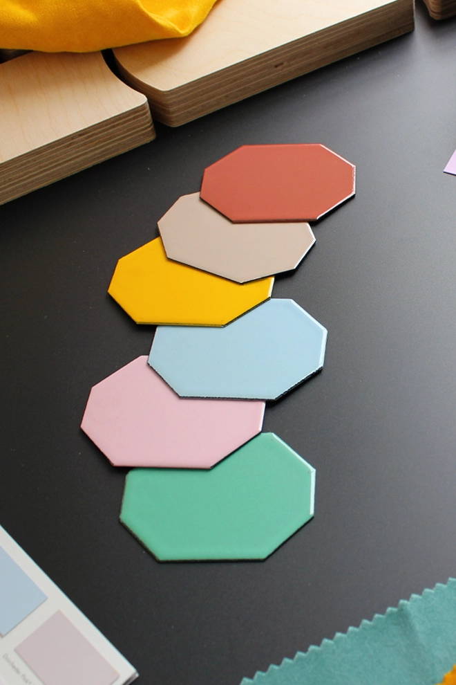 Flat‑lay of vitreous enamel Coolicon lampshade swatches showcasing colour options for contemporary pendant lighting