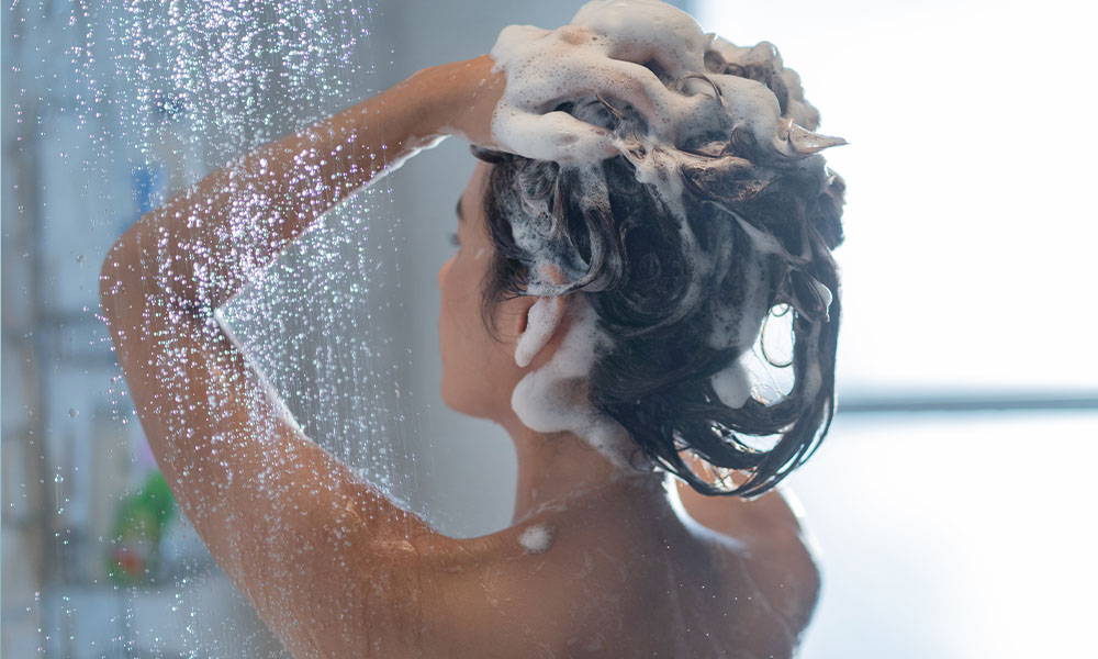 woman washing hair with castile soap