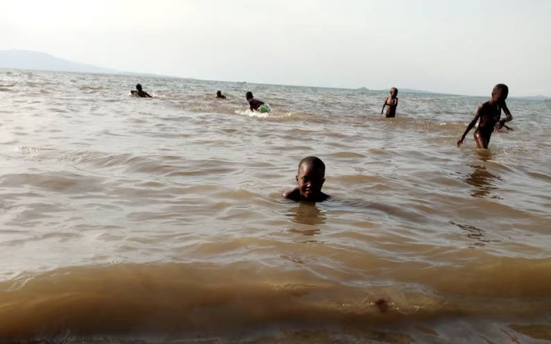 kids swimming in ocean