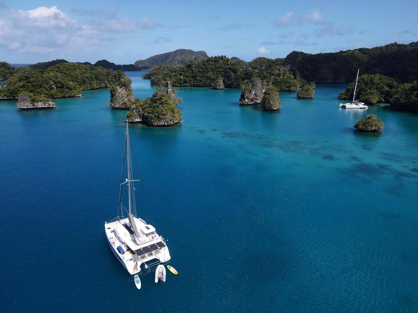 Sailboat near the Bay of Islands, beautiful atolls and beaches, FIJI area