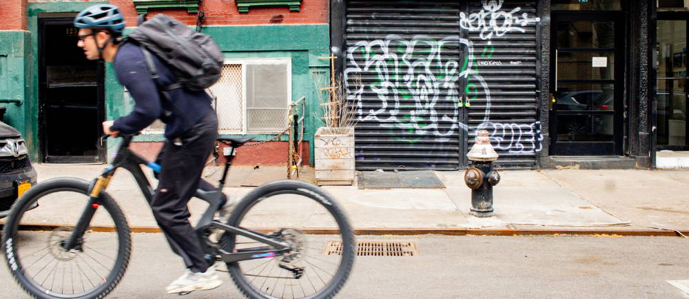 male riding an ebike fast