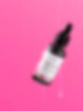 A sleek bottle of face serum with a dropper, displayed on a white pedestal against a vibrant pink background.