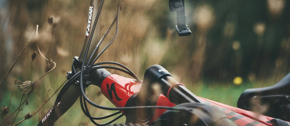a red Specialized electric mountain bike in the grass