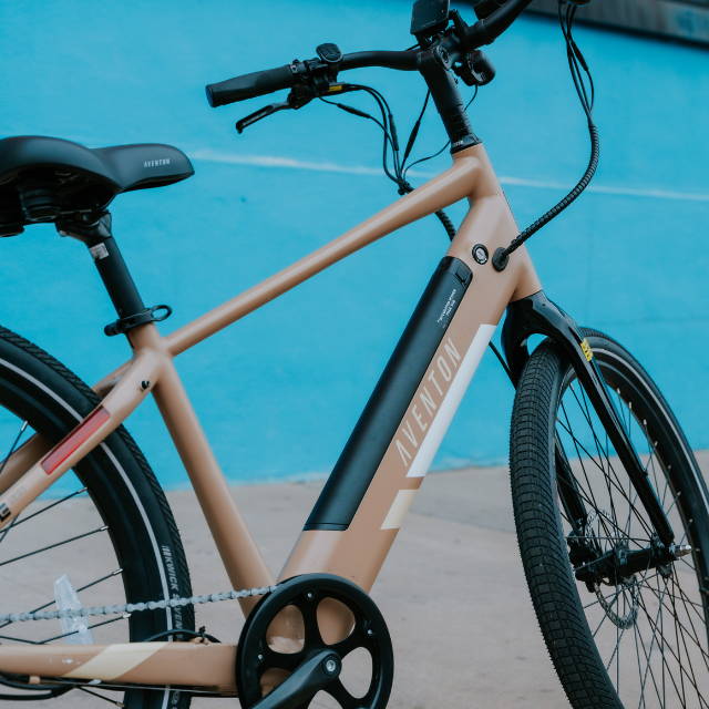 a tan Aventon Pace 500.2 electric commuter bike