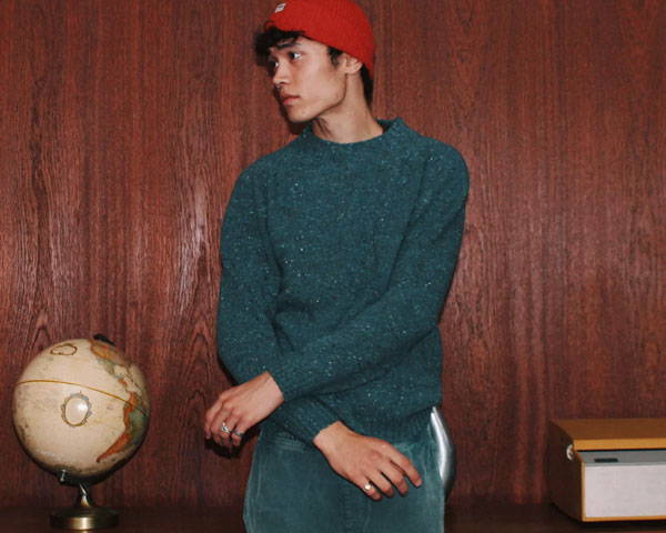 Man wearing turquoise wool jumper from men's uk clothing brand Idioma