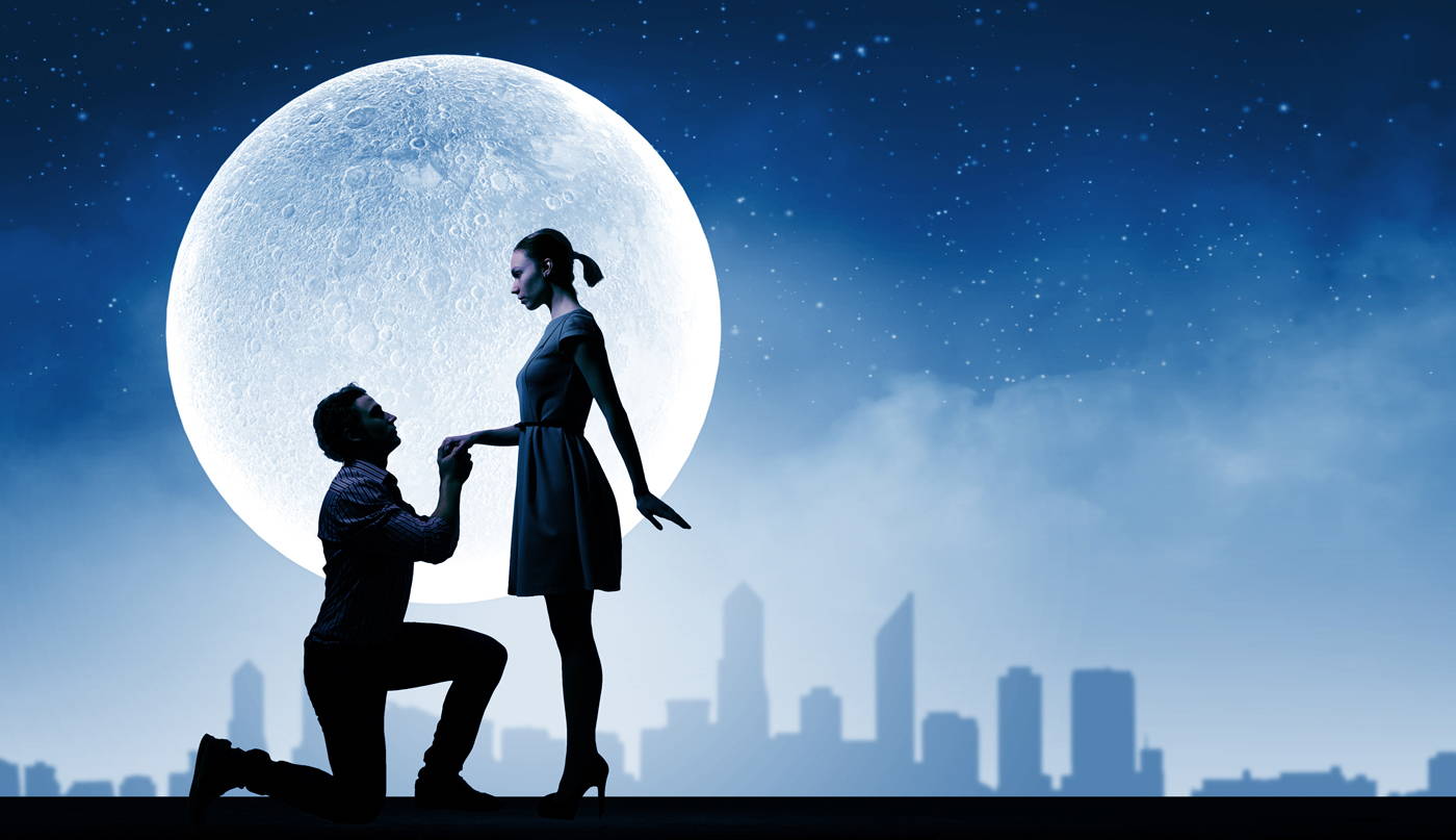 Man proposing to woman in moonlight
