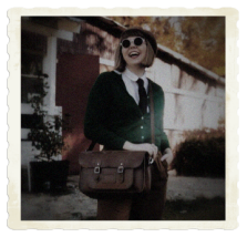 Lady wearing Vintage Clothes with a Distressed Leather Satchel