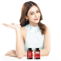 beautiful lady with two bottle of krill oil singapore in front of her