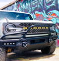 white ford bronco modular bumper with white fog lights and white 30in light bar and bullbar