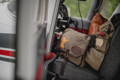 close up of a grand marais mail bag with a mn patch in the pilot seat of a byplane.