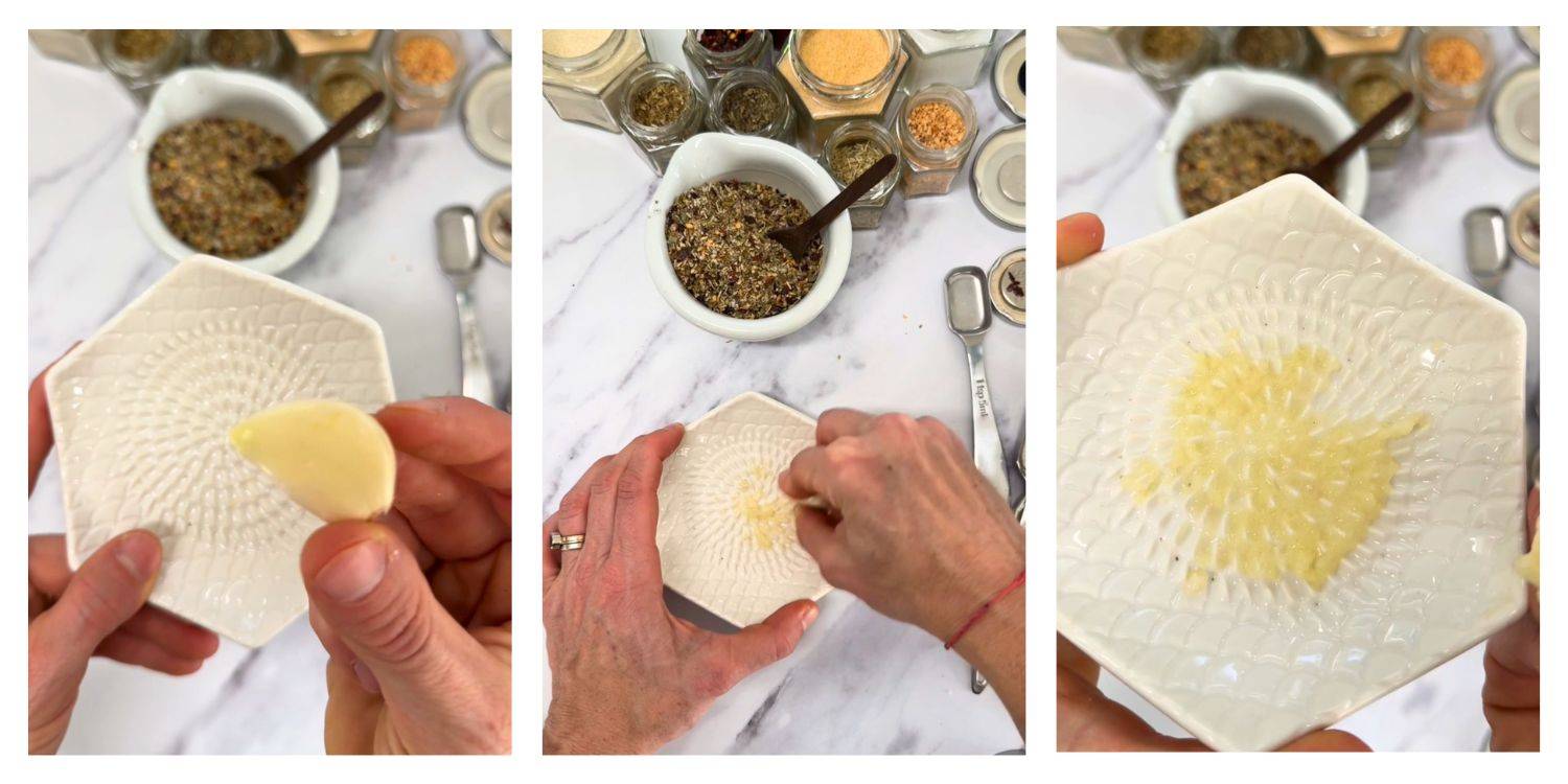 A garlic clove being grated on a white ridged garlic grate plate