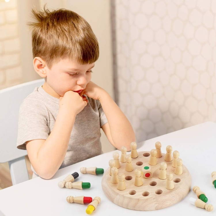 A boy looking at the Montessori Memory Match.