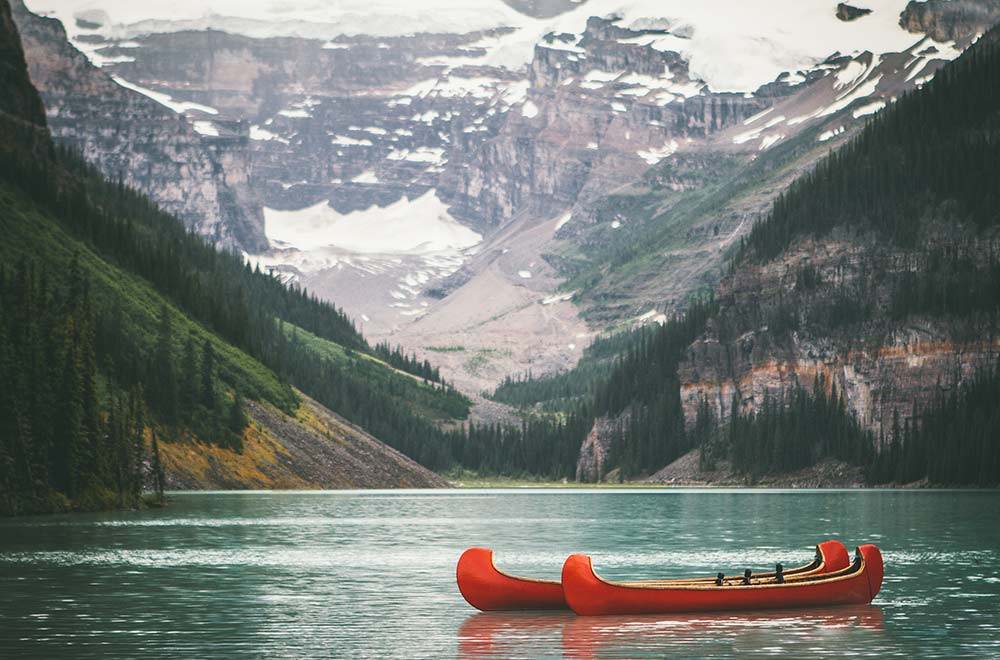 canoe on a lake in the rockies