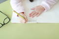 Child practicing writing letters.