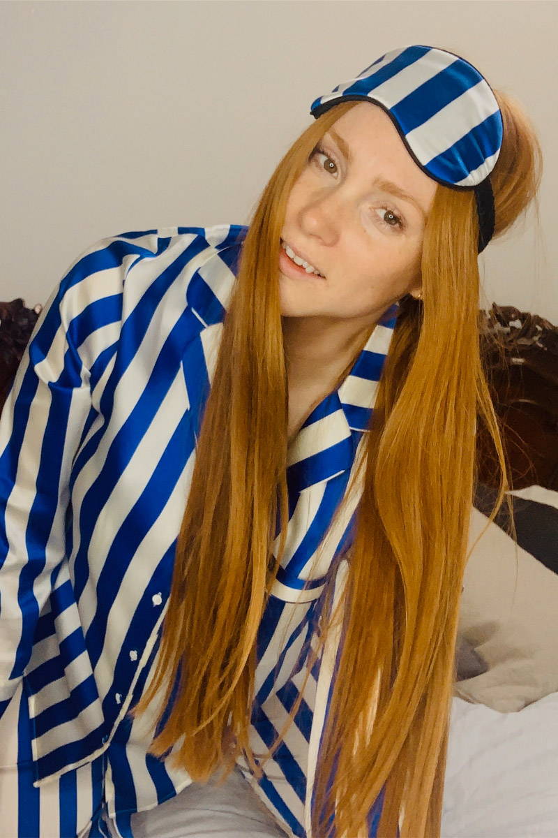 Aimee Croysdill  in Cobalt Blue & White Stripe Classic Silk Pyjamas posing in bed