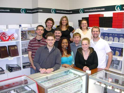 modern photo of the current Colonial Acres Coins Kitchener showroom and staff