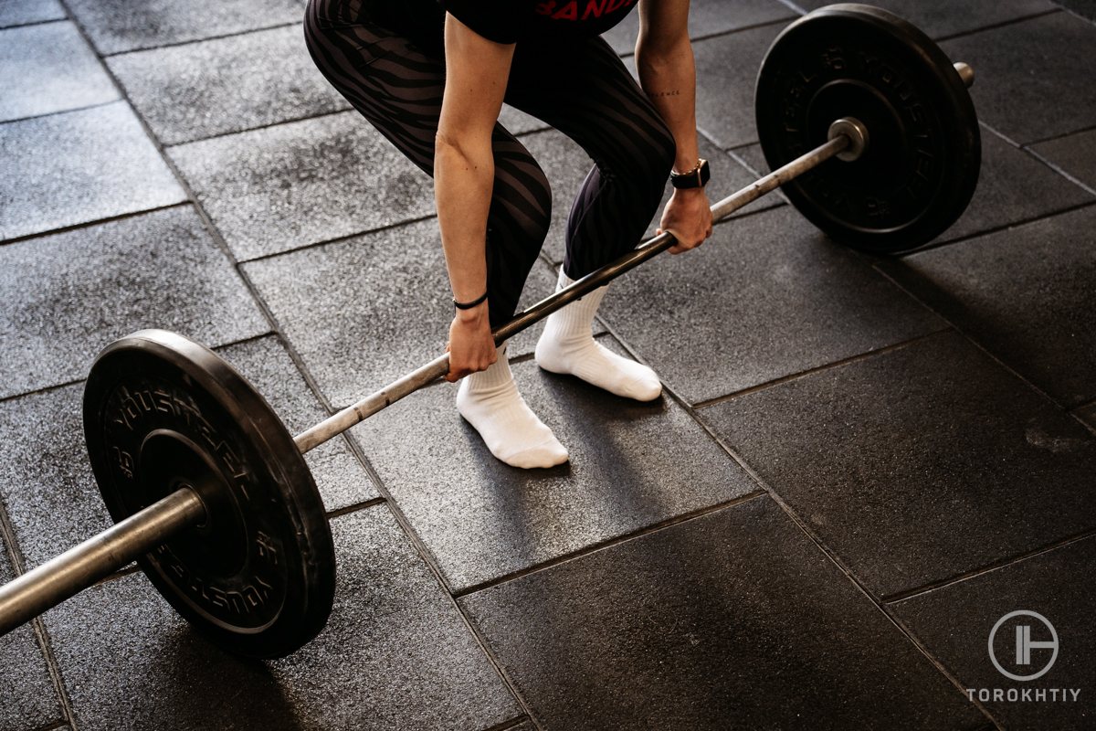 Woman lifting a barbell in the gym