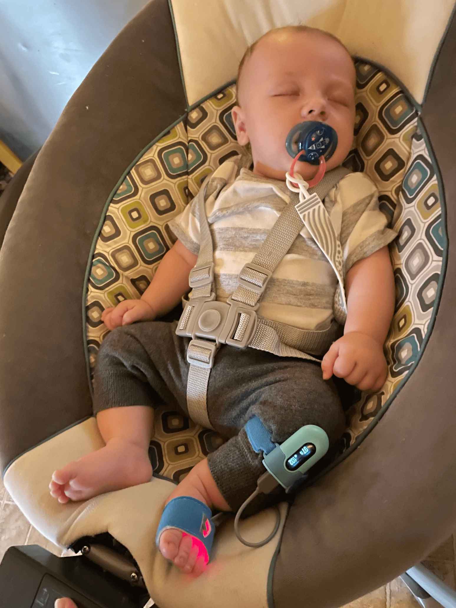 Mrs Hendrix's son is wearing Wellue Baby O2 peacefully in his chair.