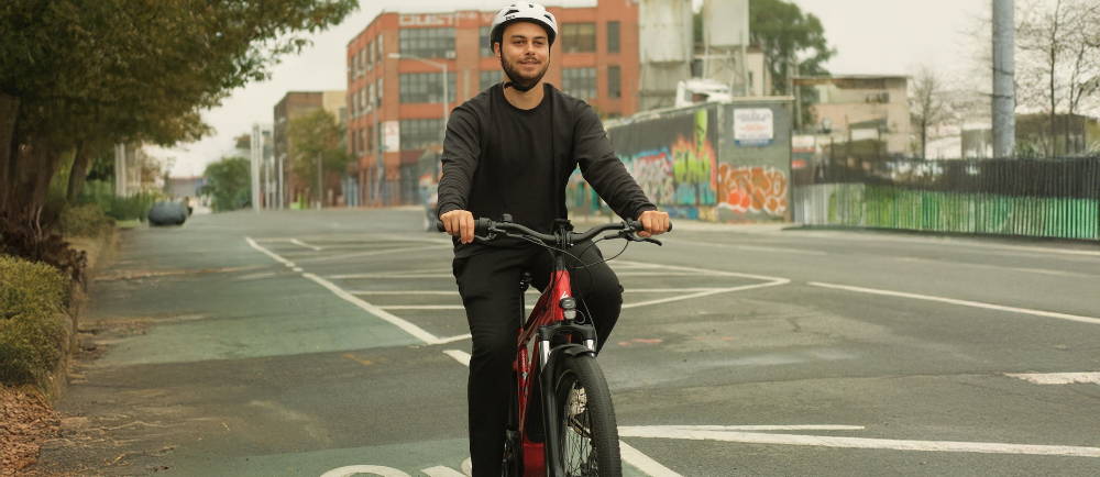 a man riding an electric city bike in new york city