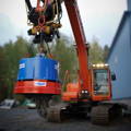 a crane lifting a blue container