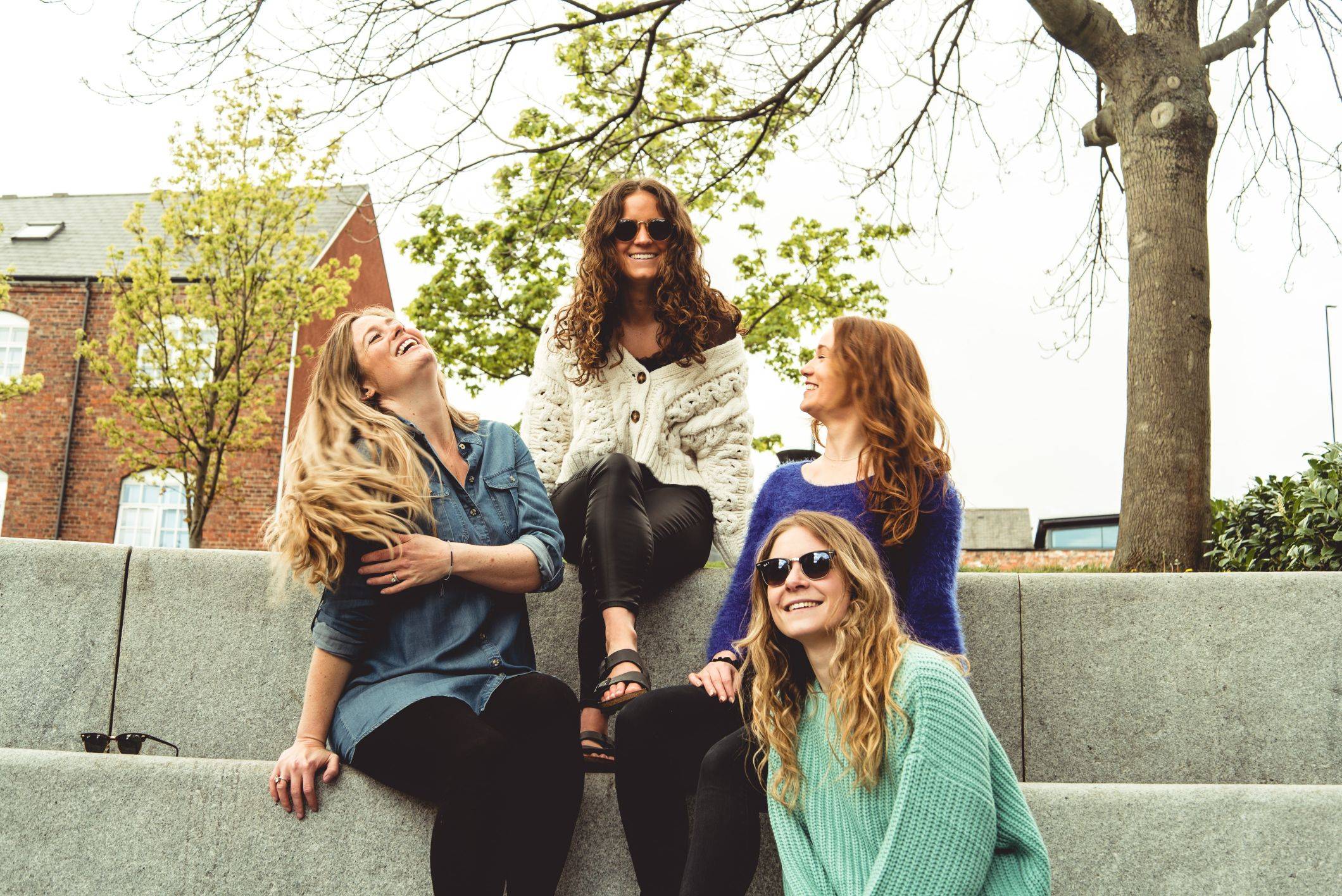 Image of girls sitting on steps laughing