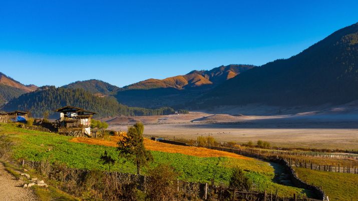 Phobjikha Valley is one of the few glacial valleys in Bhutan, characterized by its lush landscapes, verdant meadows, and the picturesque Gangtey village, offering visitors an enchanting glimpse into traditional Bhutanese rural life