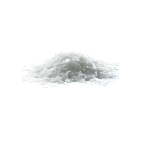 pile of magnesium chloride flakes on white background