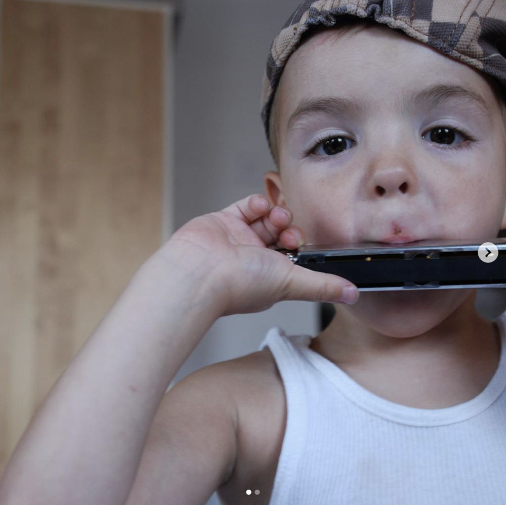 A child playing the harmonica