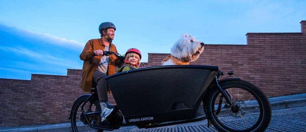 Family on Urban Arrow front loading electric cargo bike