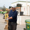 Outdoor Work Employee Staying Cool with Mission Gloves & Hat