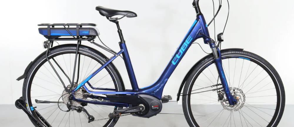 a blue Cube Touring Hybrid Pro 500 electric city bike