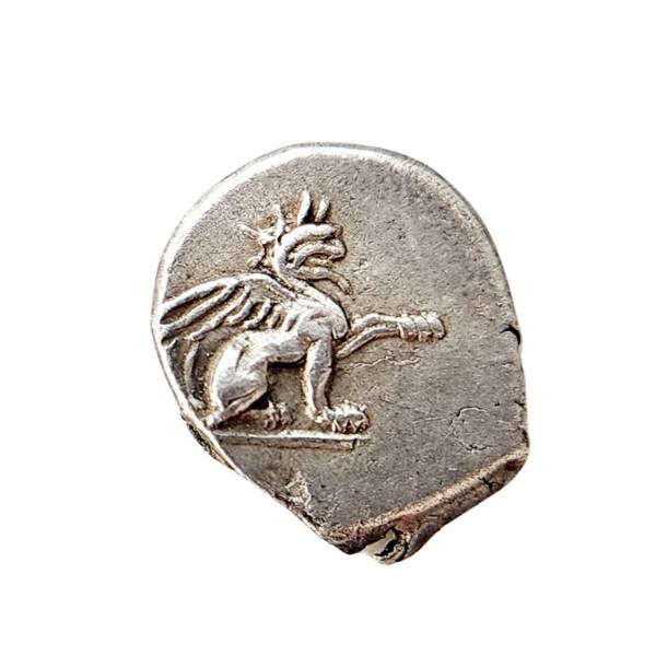 Ancient Greek silver coin of a griffin  - half lion and half eagle
