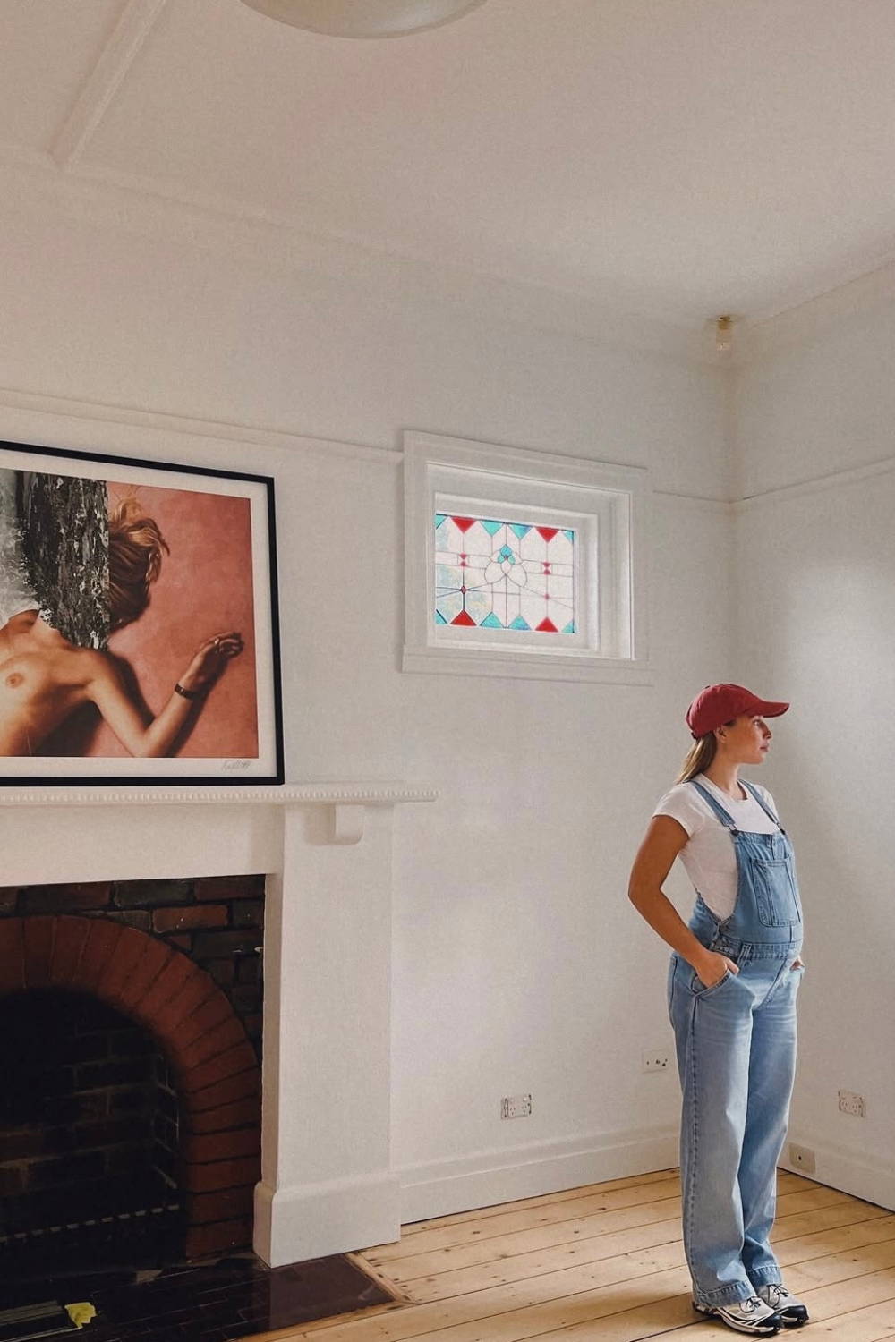 'Catch Your Breath' by Dina Broadhurst - A framed photographic print captured in a living room setting above the fireplace.