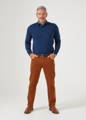 Men's blue polo shirt with brown chinos