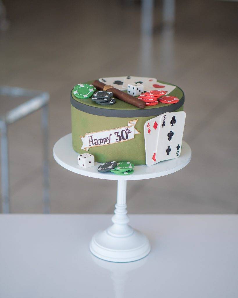 Birthday cake designed for the special man in your life. Decorated with playing cards and poker chips made with fondant. Order yours today at House of Clarendon in Lancaster, PA.