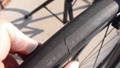 A photo of a bicycle tire with some cuts.