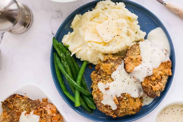 Photo of PREMIUM Beef Texan Chicken Fried Steak with Gravy and Mashed Potatoes