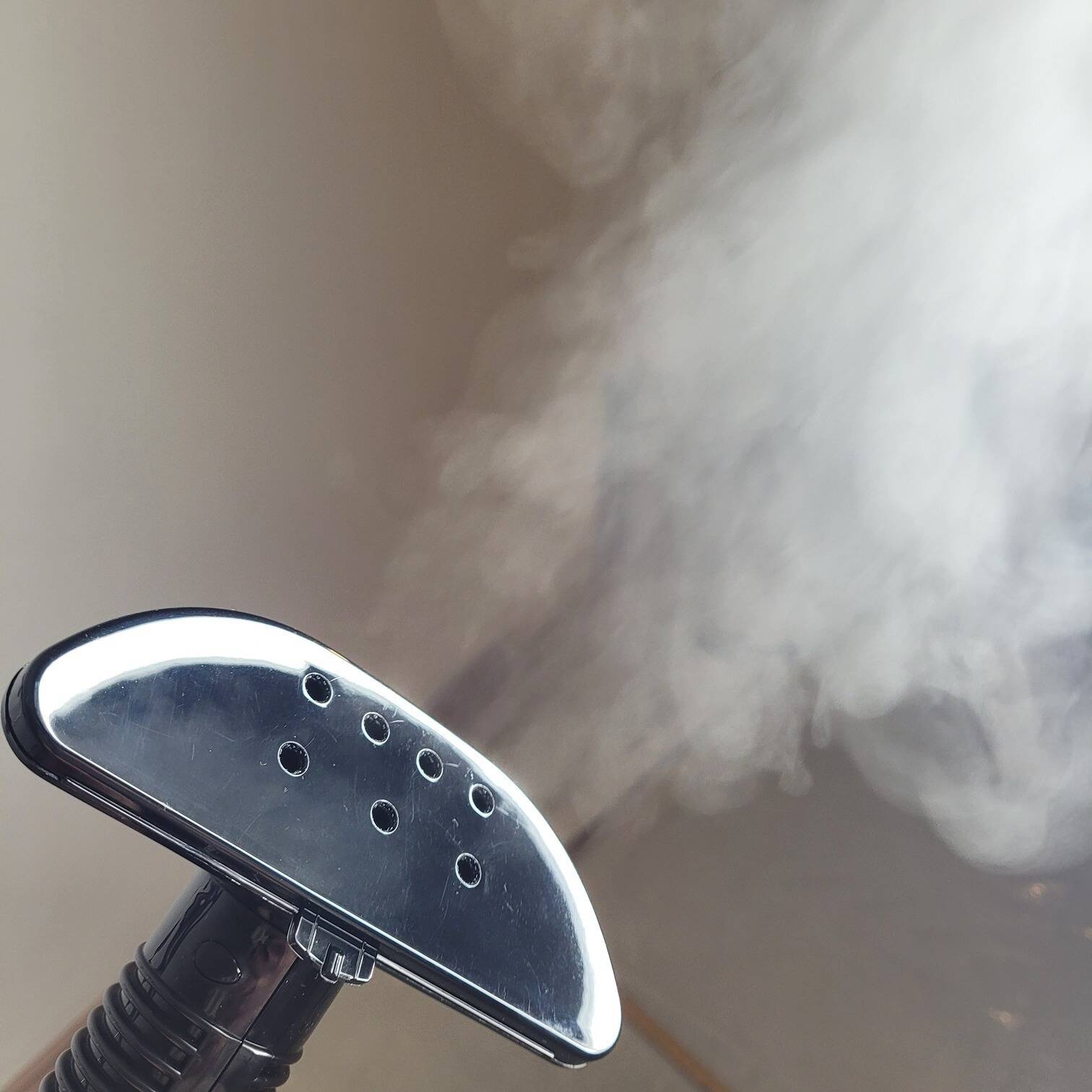a photo of a steamer emitting hot white steam into the air